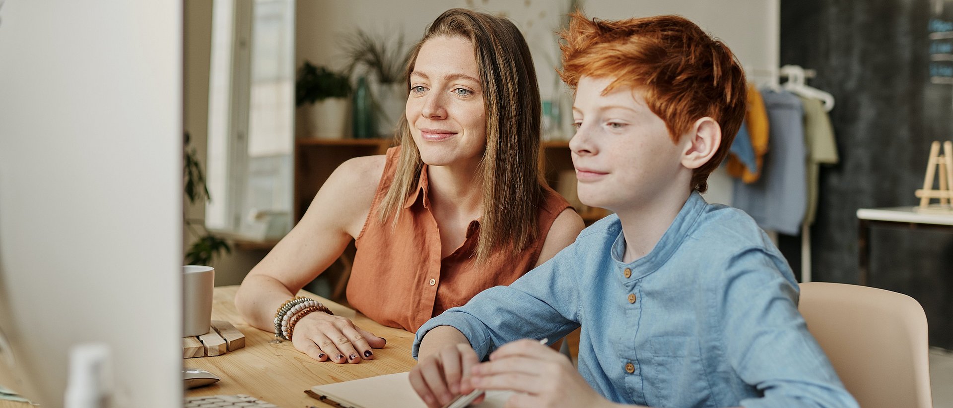 Woman and boy doing school homework