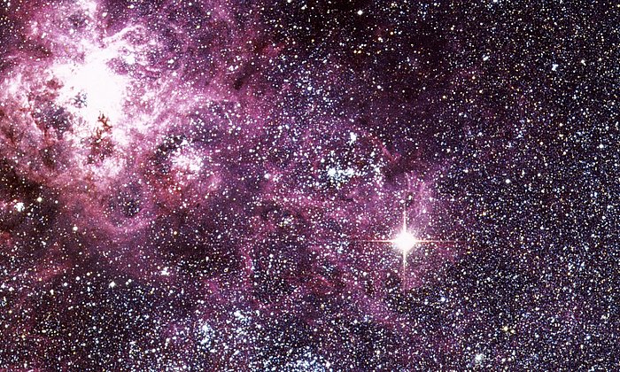 Bright stellar explosion among many stars.