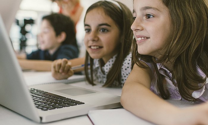 Pupils and teachers on a tablet