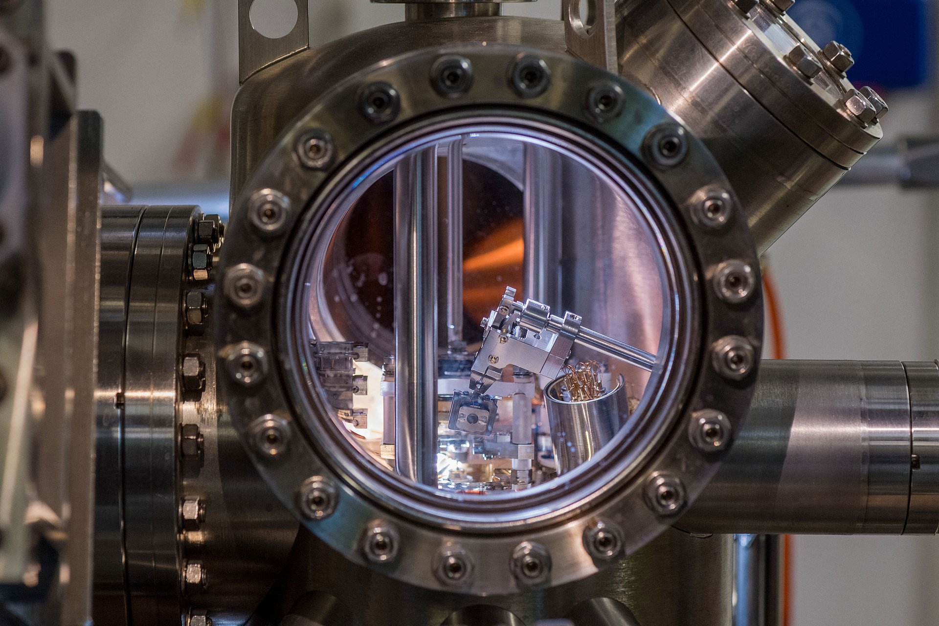 The sample is positioned in the scanning tunnelling microscope (STM), which is located in the vacuum chamber.