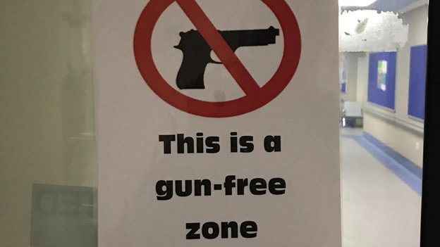 Sign saying "This is a gun free zone"