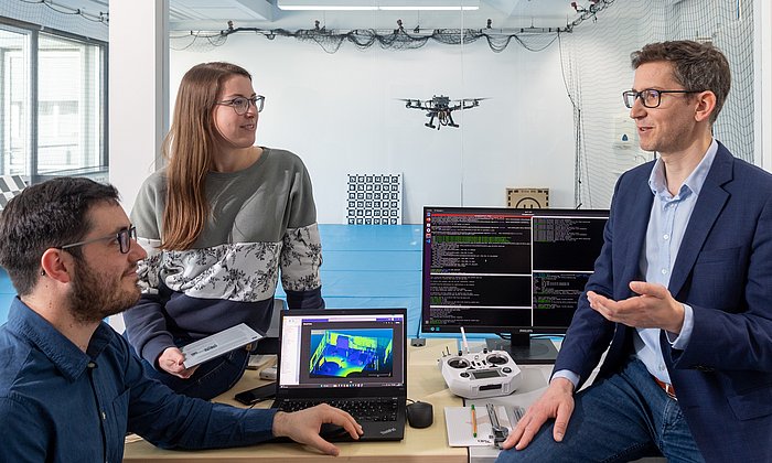 Researchers in a robotics laboratory.