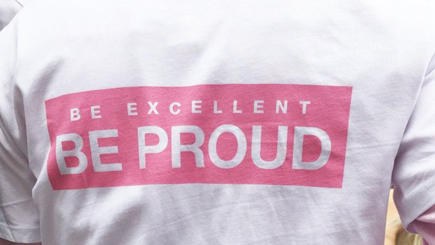 Slogan on Shirt "Be proud, be excellent"