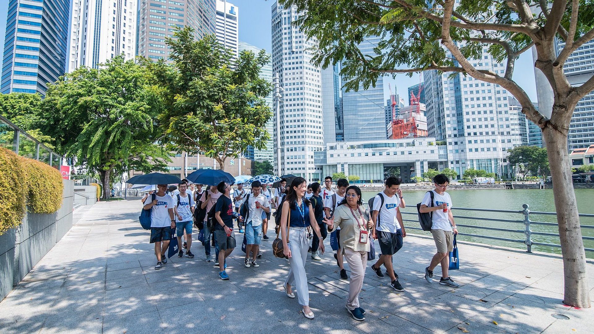 A group of students walking through the city of Singapore