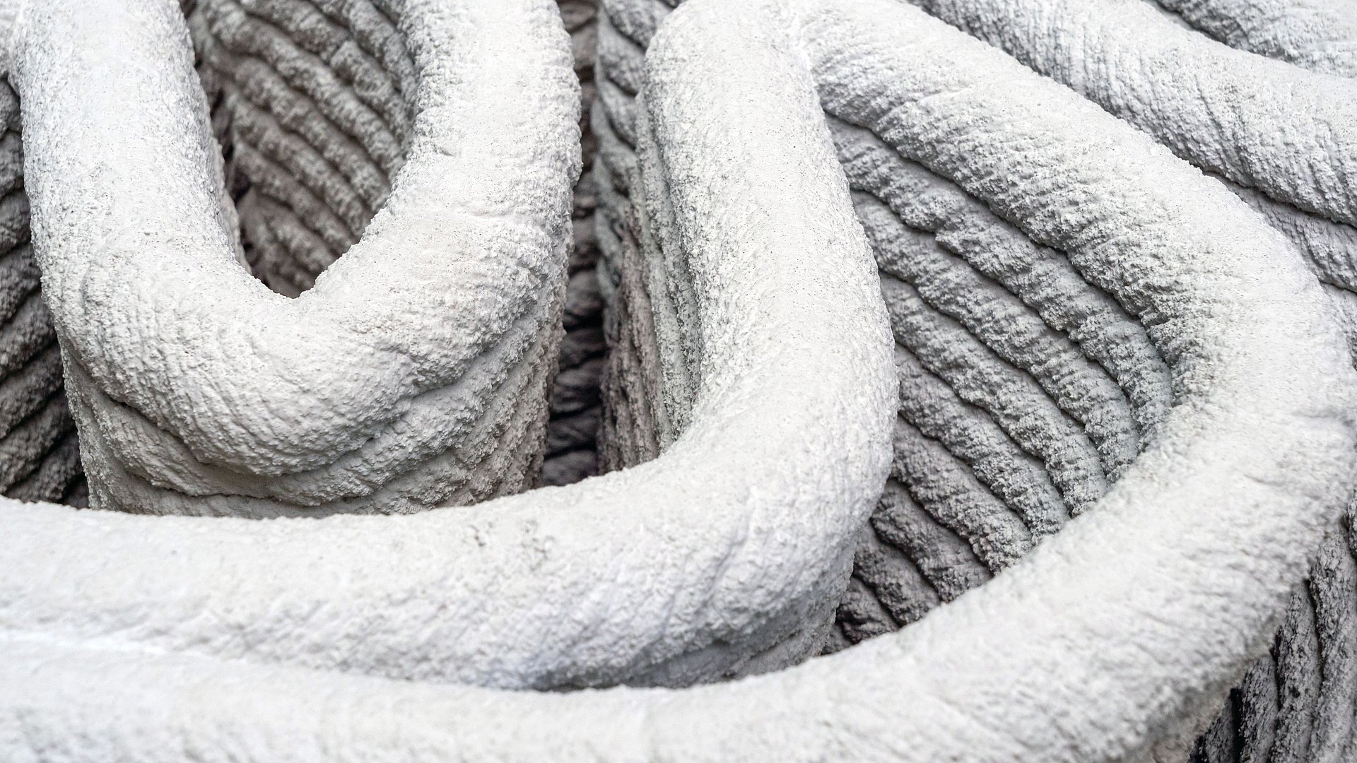 Beton aus dem 3D-Drucker. Nahaufnahme von Beton aus dem 3D-Drucker.
