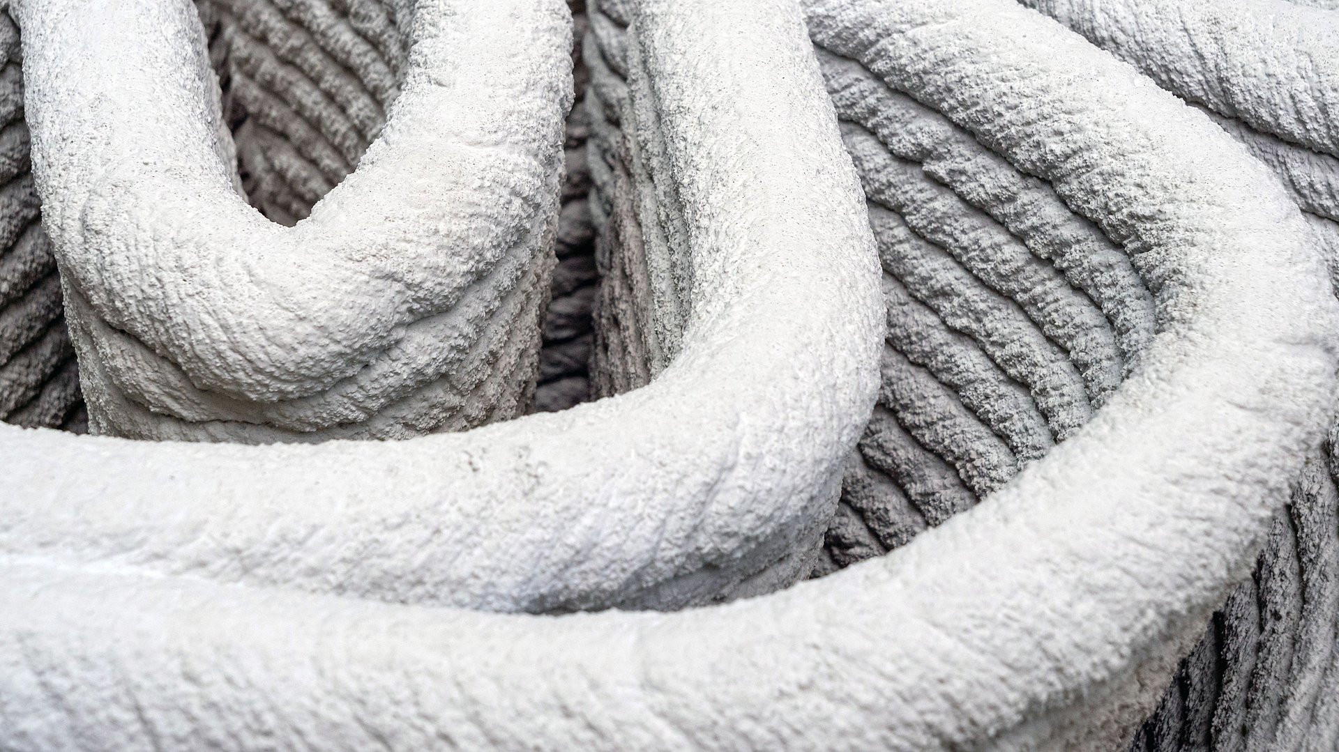 Close-up of concrete from the 3D printer. Close-up of concrete from the 3D printer.