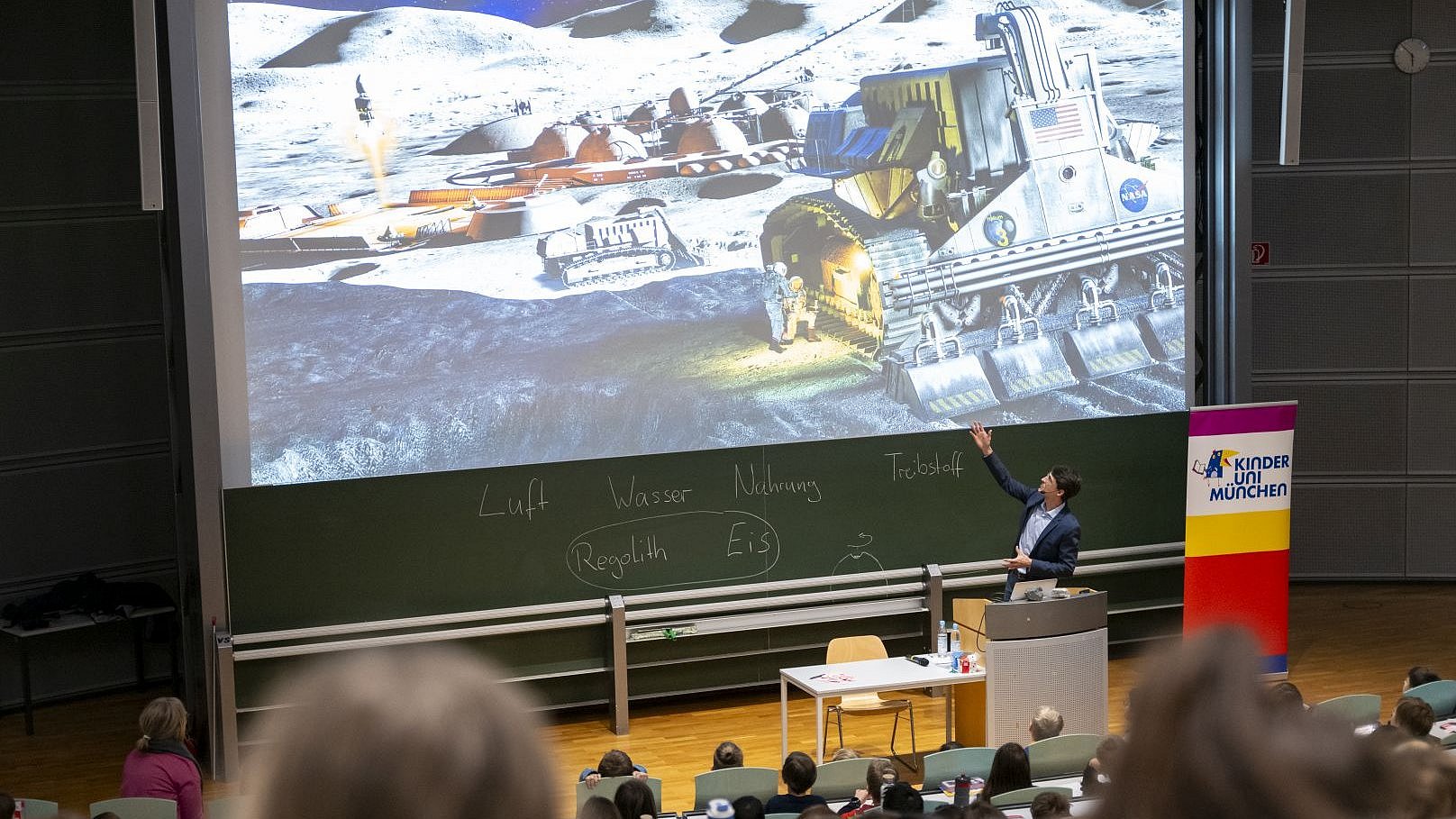 Prof. Reis gives a lecture to children on treasures on the Moon