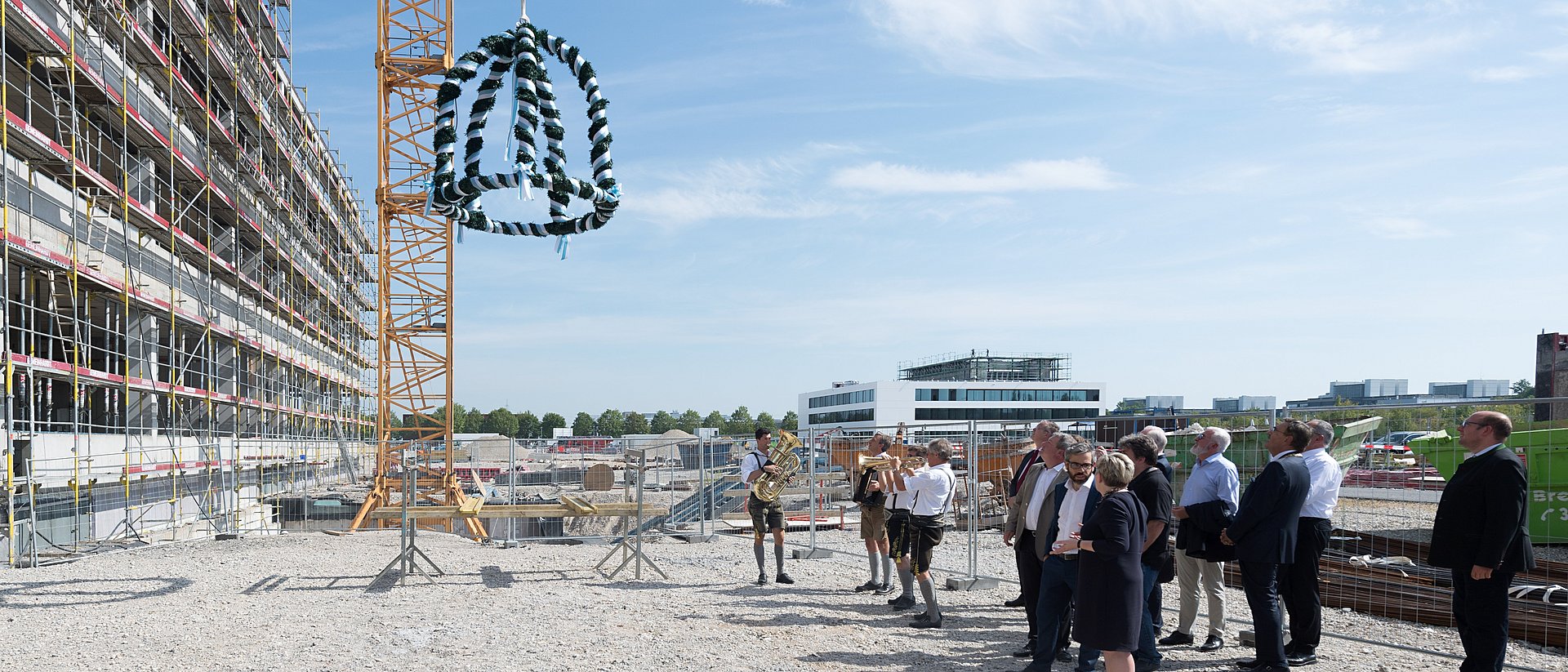 The topping-out crown is raised on the new ECE building