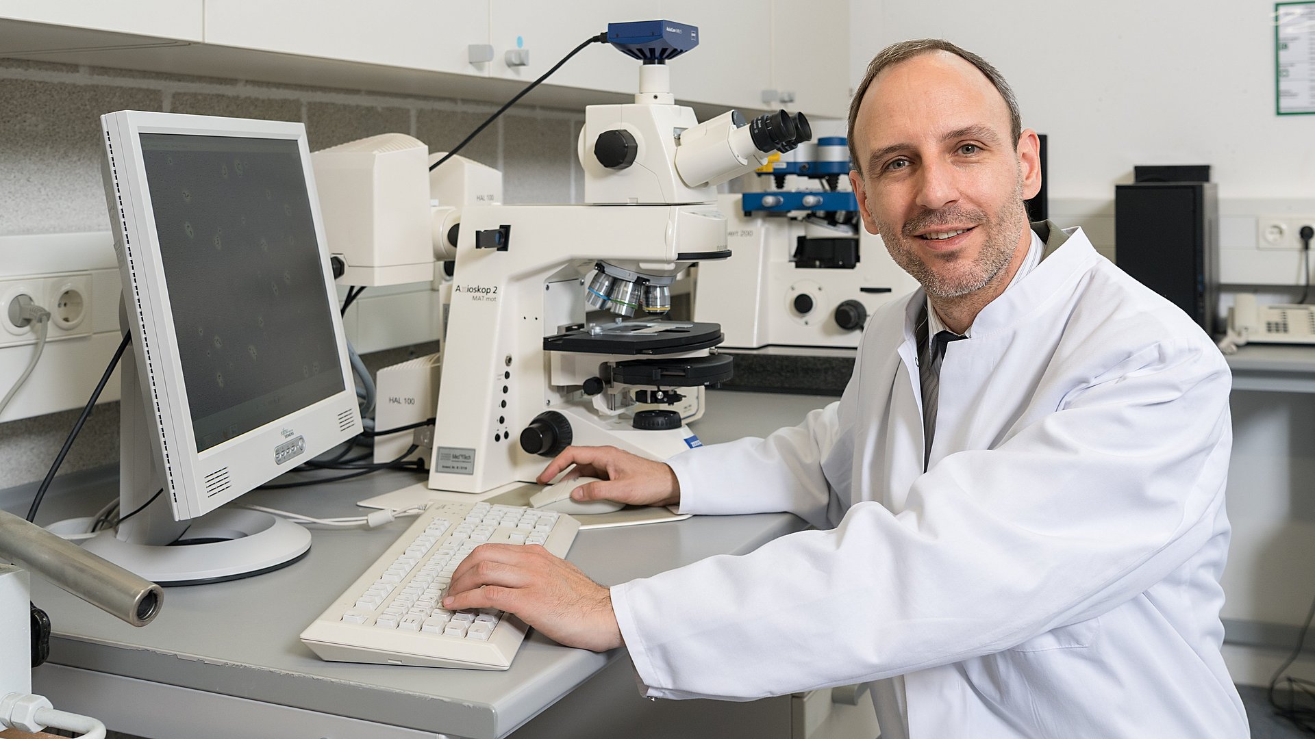 Prof. Oliver Lieleg sitting at his desk.