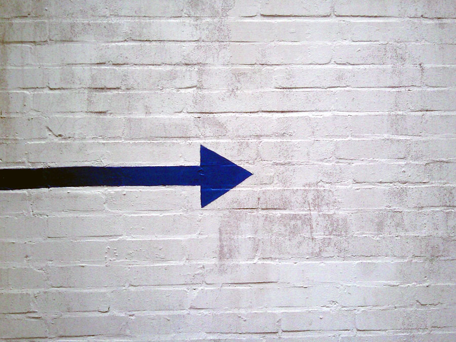 Blue arrow on wall