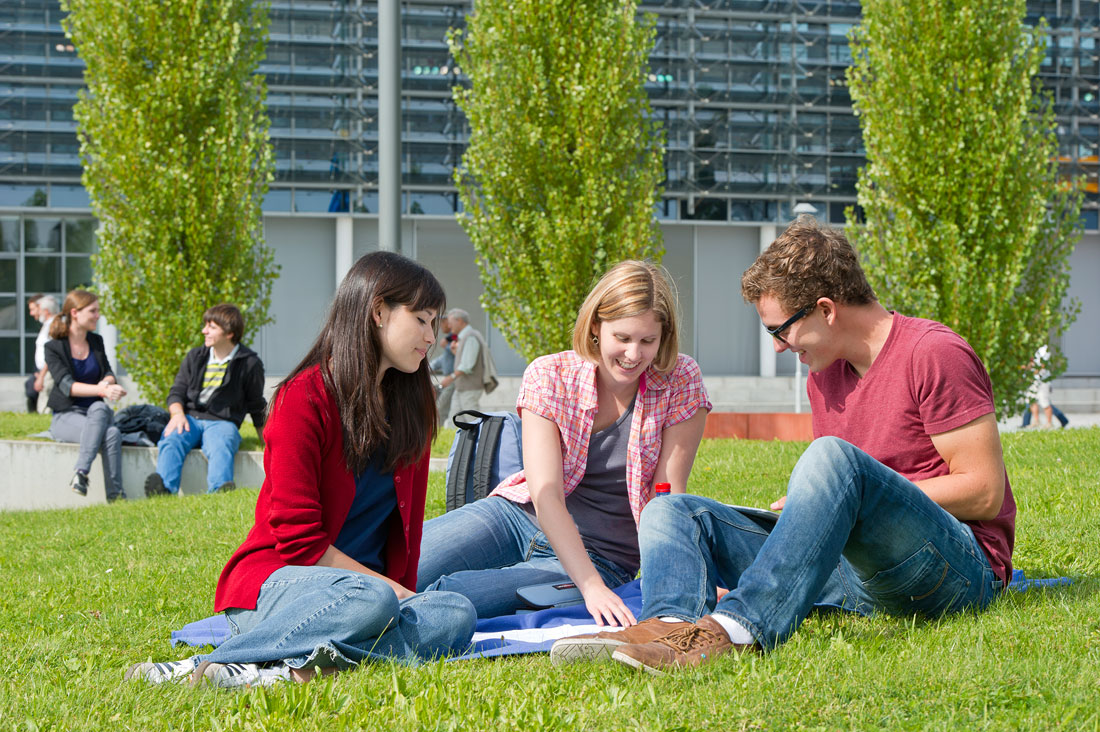 Three students on a blanket