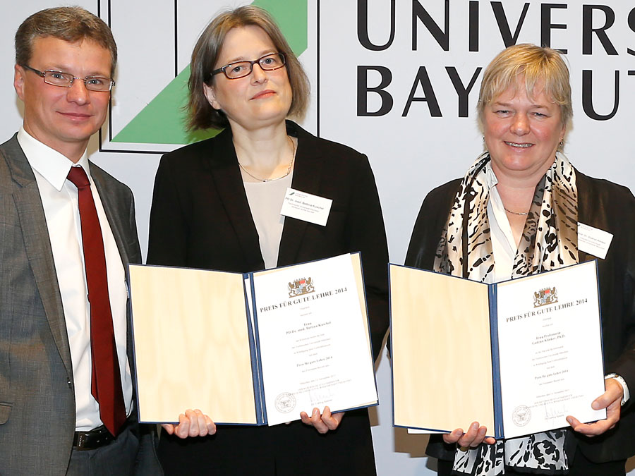 Secretary of State Bernd Sibler recognizes Bettina Kuschel and Gudrun Klinker (left to right) for their teaching excellence.