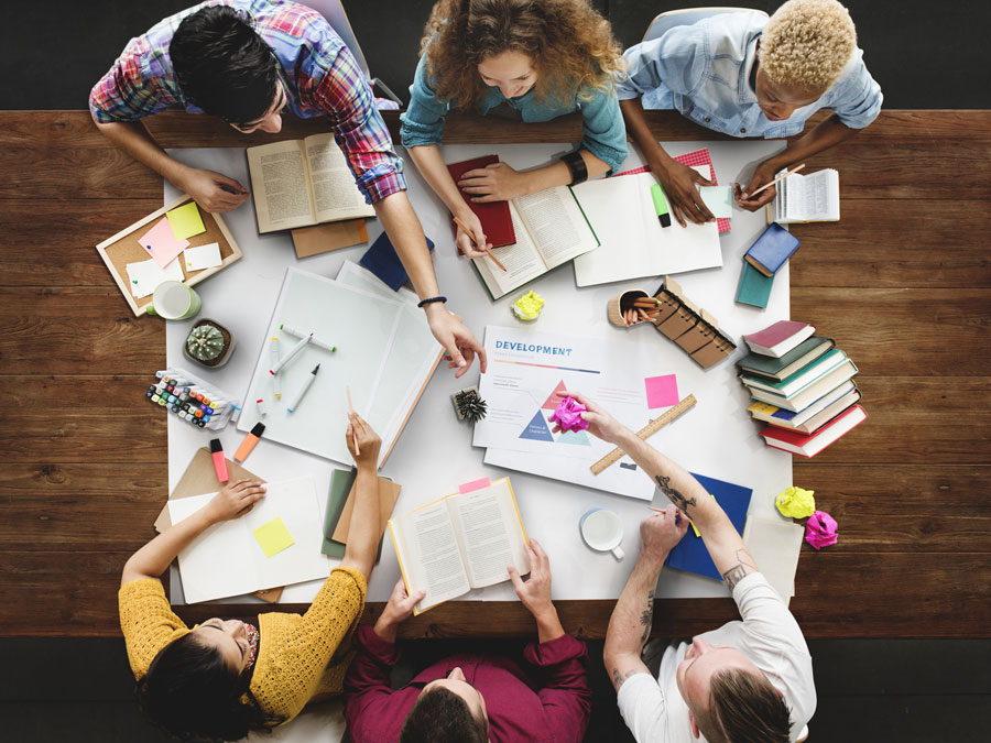 Young people at a classroom table