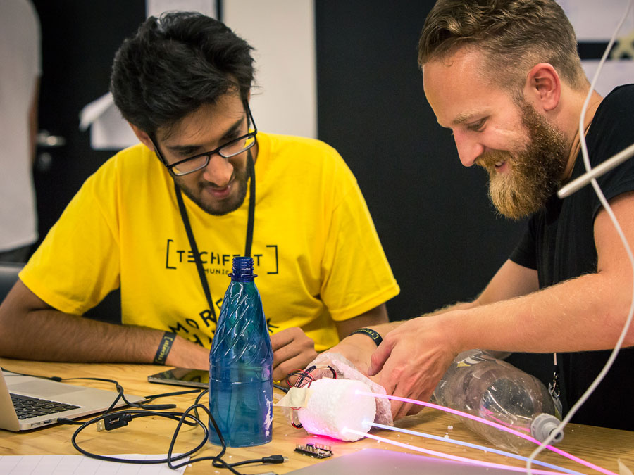 Two participants at the Techfest building a prototype