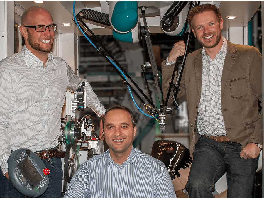 Cevotec founders Felix Michl, Neven Majic, and Thorsten Gröne with the prototype of their production system. (Photo: Cevotec) Cevotec founders Felix Michl, Neven Majic, and Thorsten Gröne with the prototype of their production system.