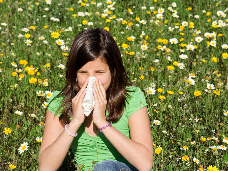 Girl blowing here nose