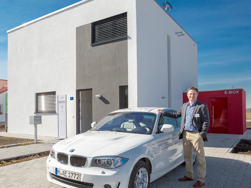 Prof. Franz Hagn in front of the energy-plus house in Hallbergmoos.