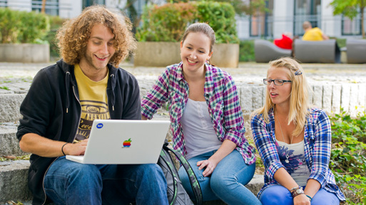 Students with a laptop on campus Students with a laptop on campus