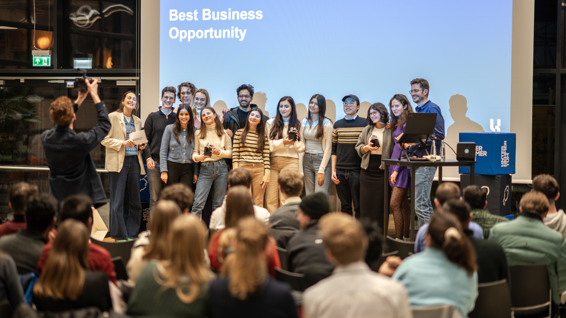 Students pitch their business ideas on stage