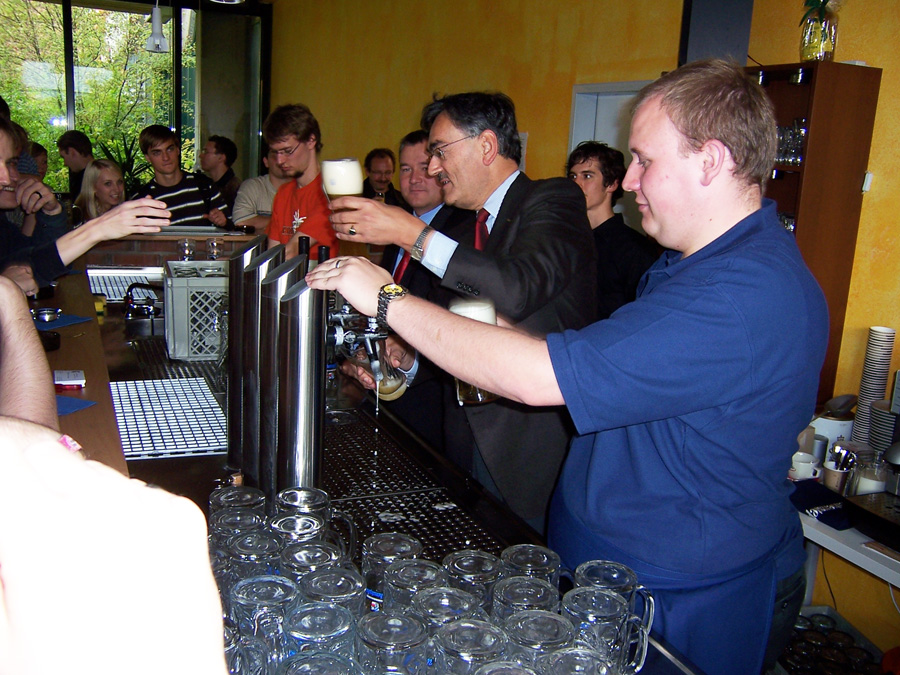 Wolfgang A. Herrmann tapping beer